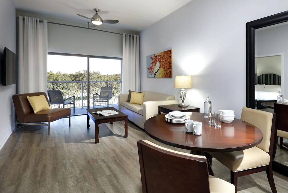 Kick back on the sofa and enjoy breezy balcony light.