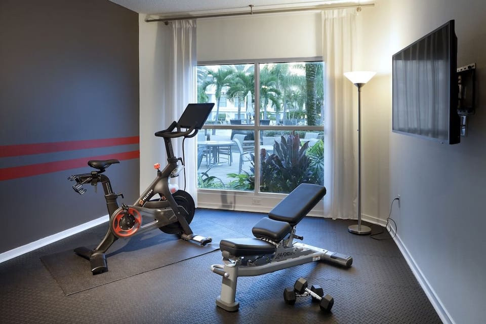Recharge with a full workout in the bright fitness room.
