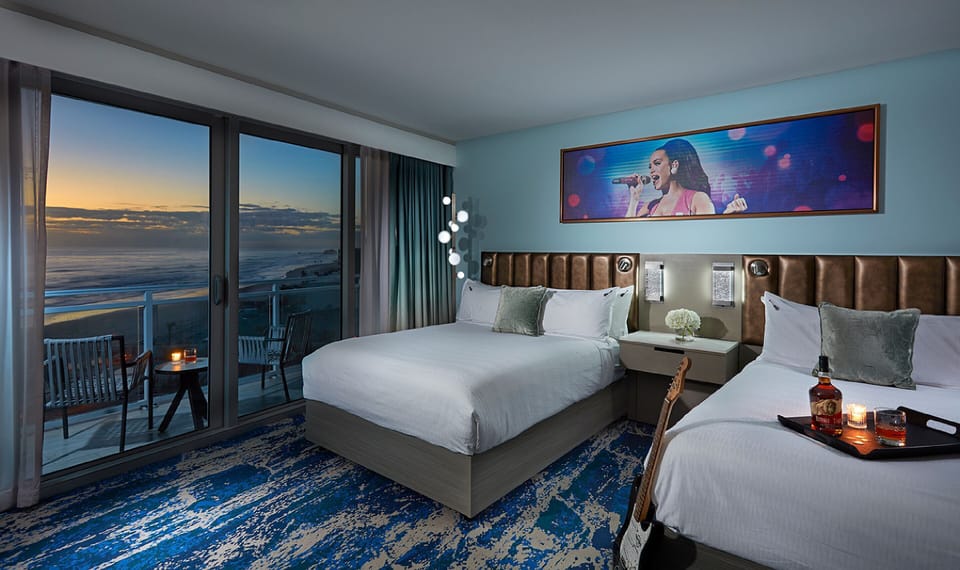 Unwind at sunset with ocean views from plush beds.