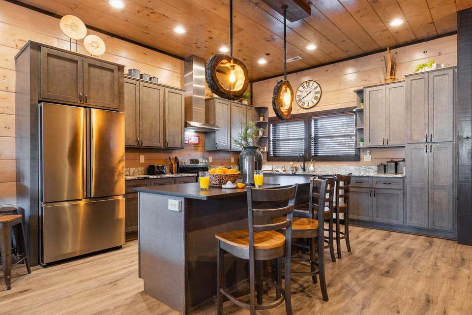Kitchen features high-end appliances fit for a chef.