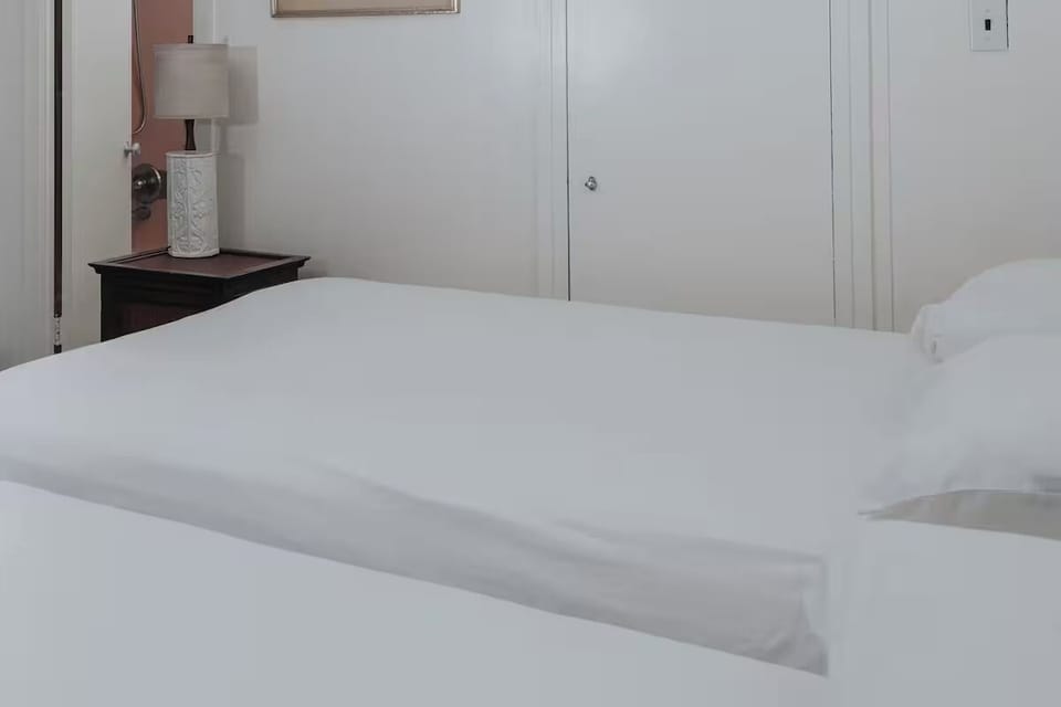 Sink into crisp linens for a calm, restful night.