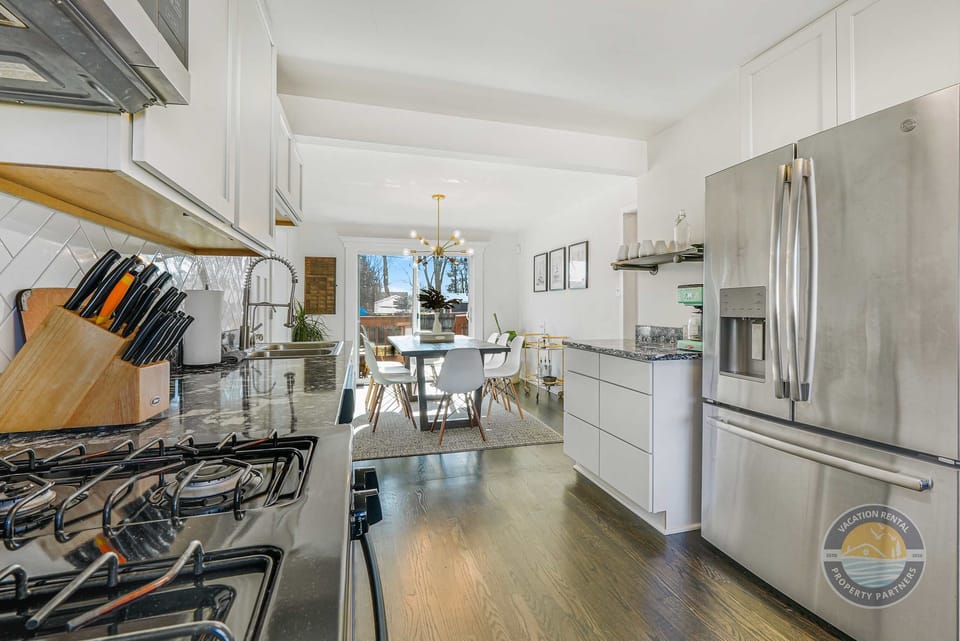 Fully equipped kitchen with everything you need to cook at home. Stainless appliances, plenty of counter space, and an open layout that makes it easy to stay connected while prepping meals.