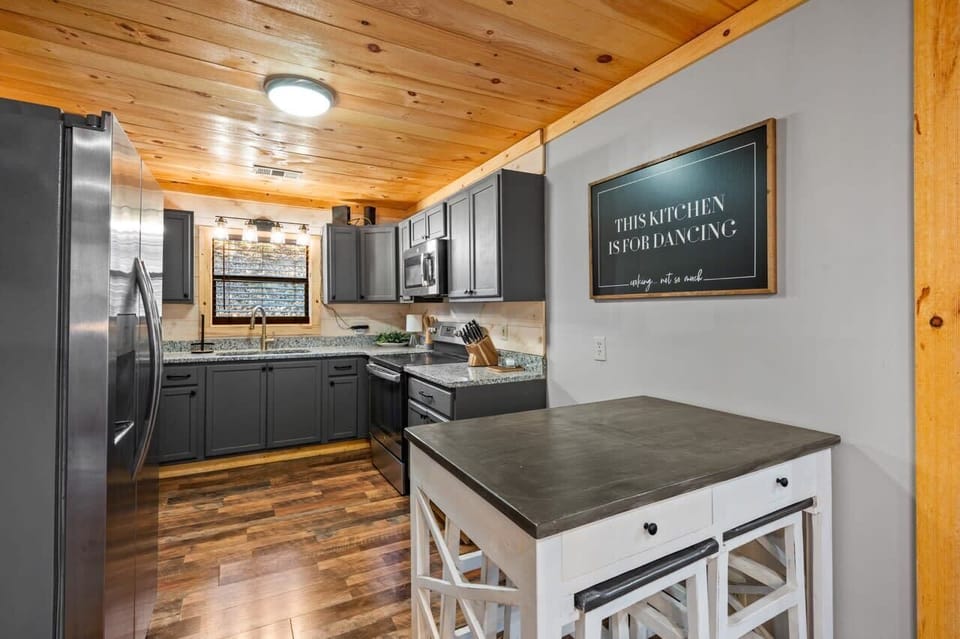 Your fully equipped kitchen! Whip up delicious meals in this stylish space with inviting natural light and modern amenities!