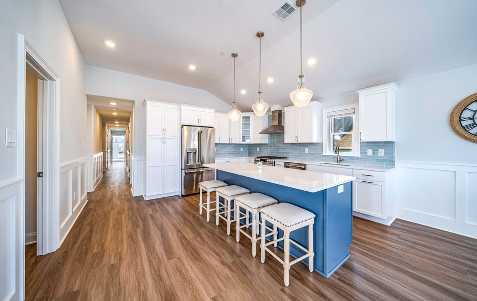 Sleek kitchen island with four bar stools