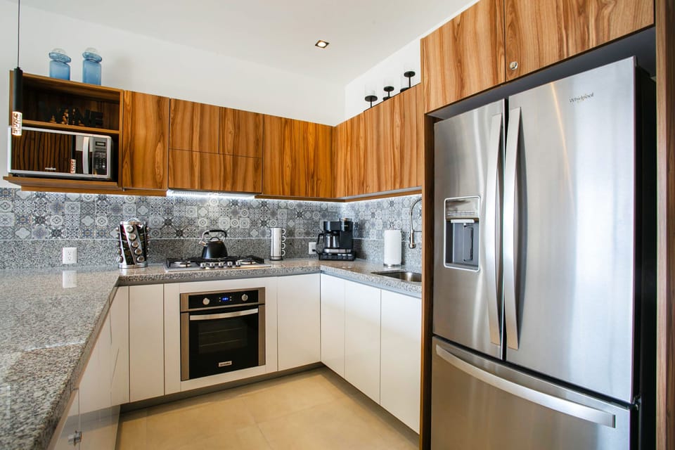 Kitchen amenities include a full-size fridge, stove, oven, microwave and coffee maker