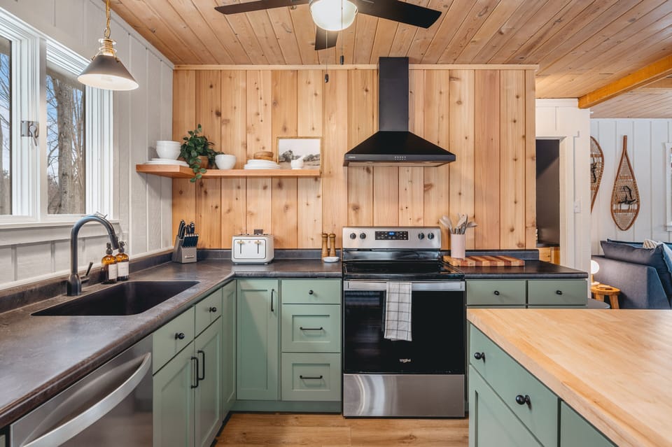 Kitchen with microwave, air fryer, crock pot, blender, toaster and more 