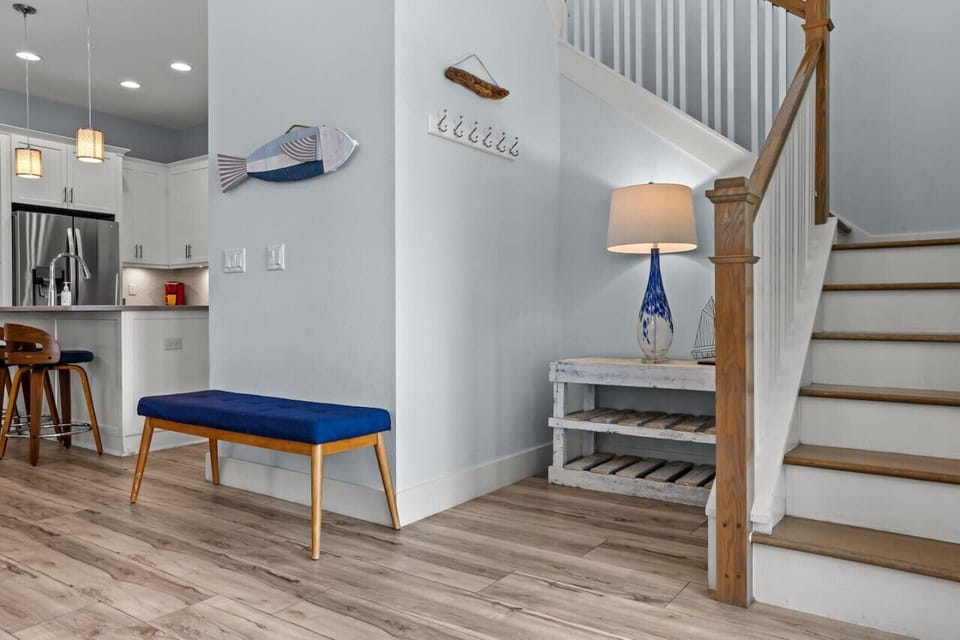 Conveniently located near the kitchen, the stair area seamlessly connects levels, ensuring easy access while maintaining the cozy beach house ambiance.