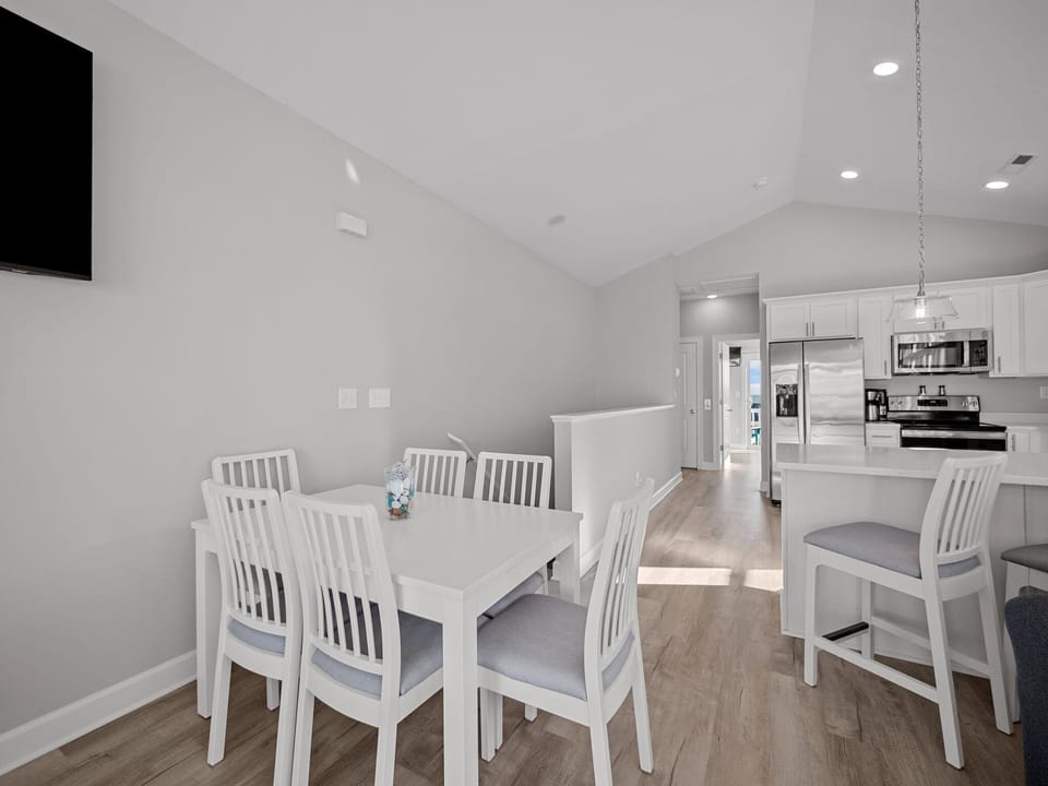 Dining area with seating for 6 and the table has a leaf for extra space.