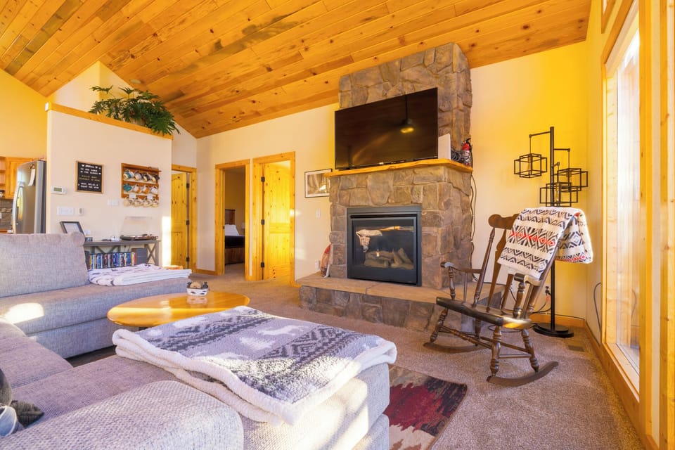 Cozy up by the fire or read your book on the rocker. How about movie night :)