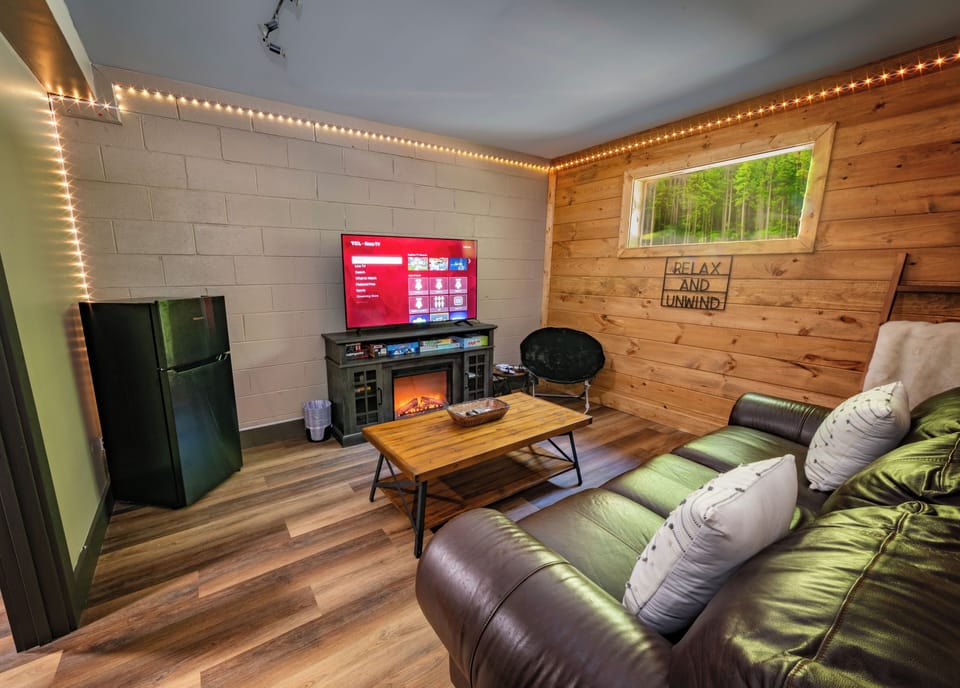 Game room with LED lights, fireplace feature, Nintendo console, and mini fridge❤️