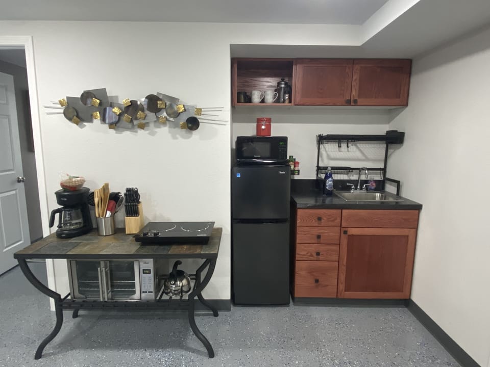 Kitchenette equipped with convection oven, coffee, burners, mini fridge, + more