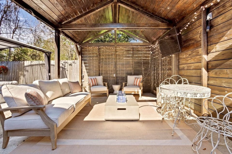 Outdoor fire pit, tv and couches