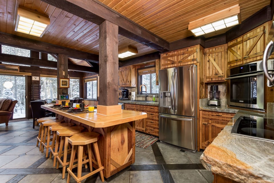 This beautifully crafted kitchen blends modern amenities with rustic charm, creating the perfect space to cook, connect, and make lasting memories.