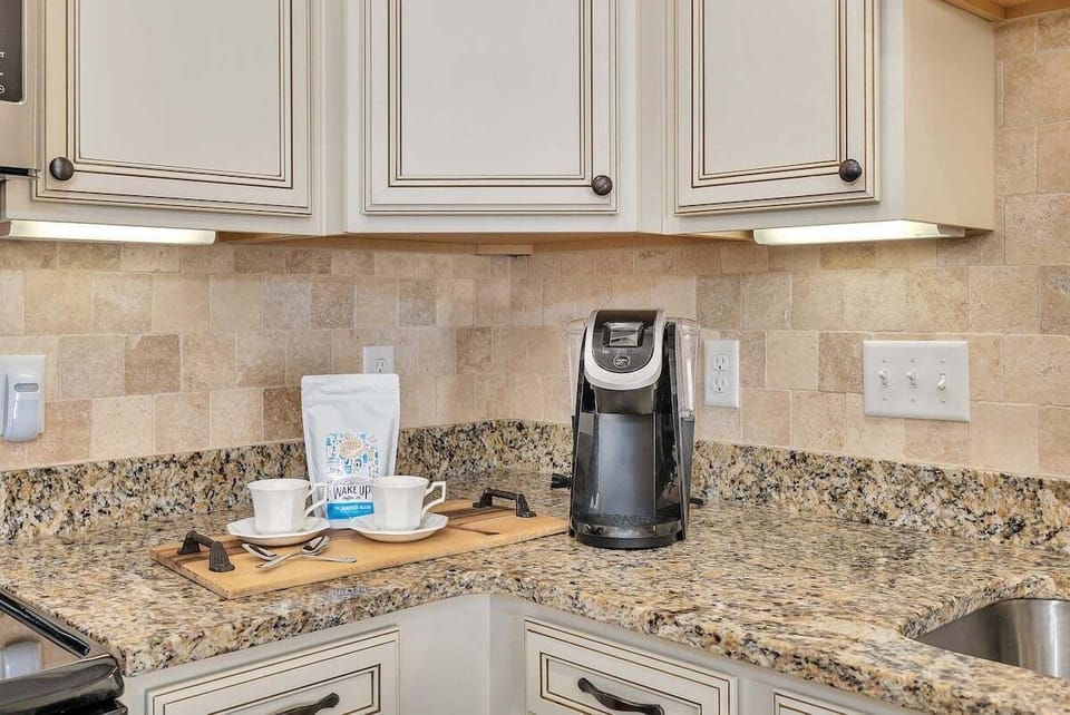 Kitchen counter with tile backsplash and coffee station