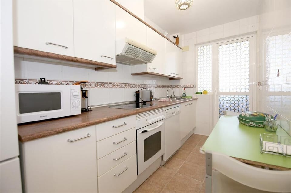 Kitchen is fully equipped with all the appliances (laundry room to the rear)