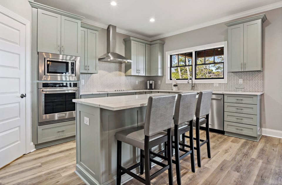 Stainless steel appliances and flat top stove with hood
