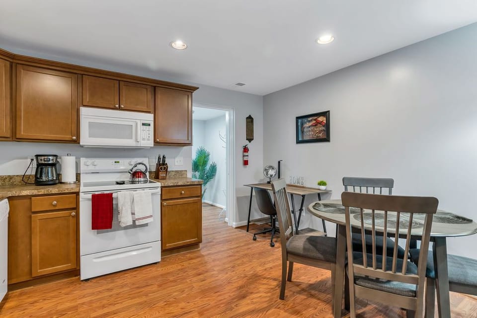 Open concept kitchen, dining and workspace that leads into the living room.  