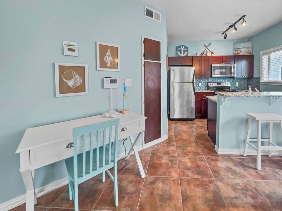 This dedicated workspace exudes productivity and comfort. The thoughtful beach decor combines a local flair with practicality and high-speed internet ensures seamless remote work!