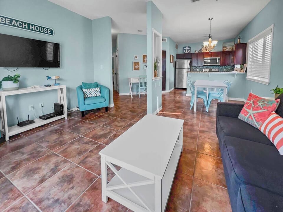 Relax in the spacious living area with convenient kitchen and dining access!