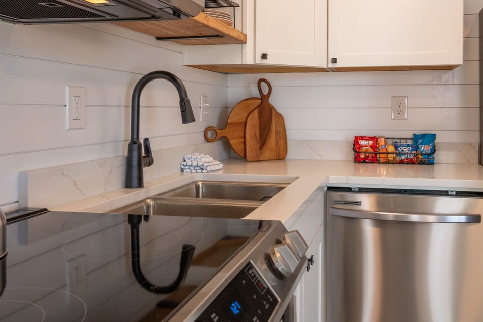 Effortless cooking in a kitchen designed for convenience! Ample counter space, abundant storage, and a fully equipped setup with pots, pans & cookware.