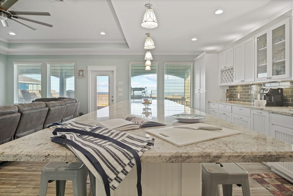 Feeling TipSea Kitchen: Retreat to your culinary oasis in this upscale kitchen, featuring designer finishes, such as brushed nickel hardware and handcrafted tile accents, creating a welcoming space to gather and savor the coastal lifestyle.