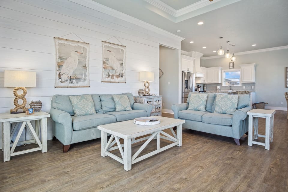 Pineapple Paradise Living Room: Discover coastal comfort in this inviting vacation rental, offering a perfect blend of style and functionality. 