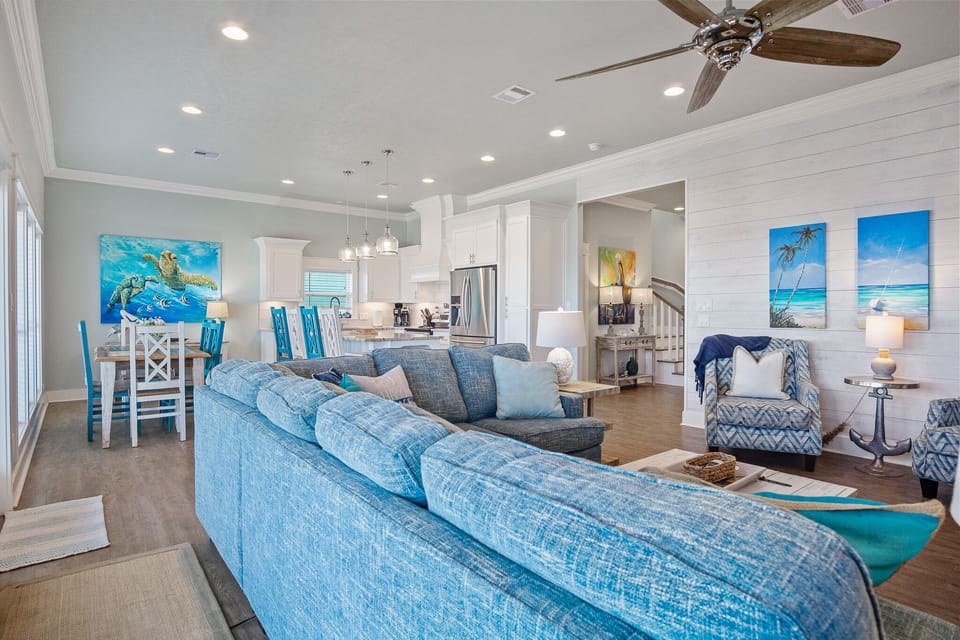 Sandy Toes Living Room:  Crafted with the utmost attention to detail, this expansive space seamlessly blends elegance with functionality, creating an atmosphere of refined comfort and style.