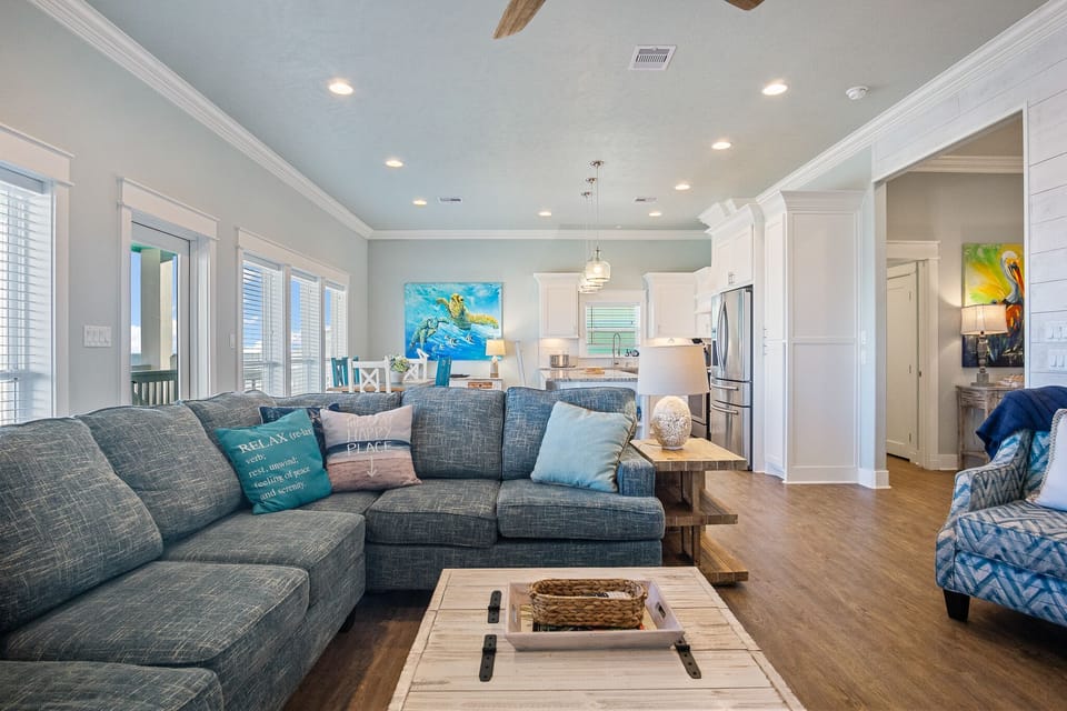 Sandy Toes Living Room: Discover coastal comfort in this inviting vacation rental, offering a perfect blend of style and functionality. 