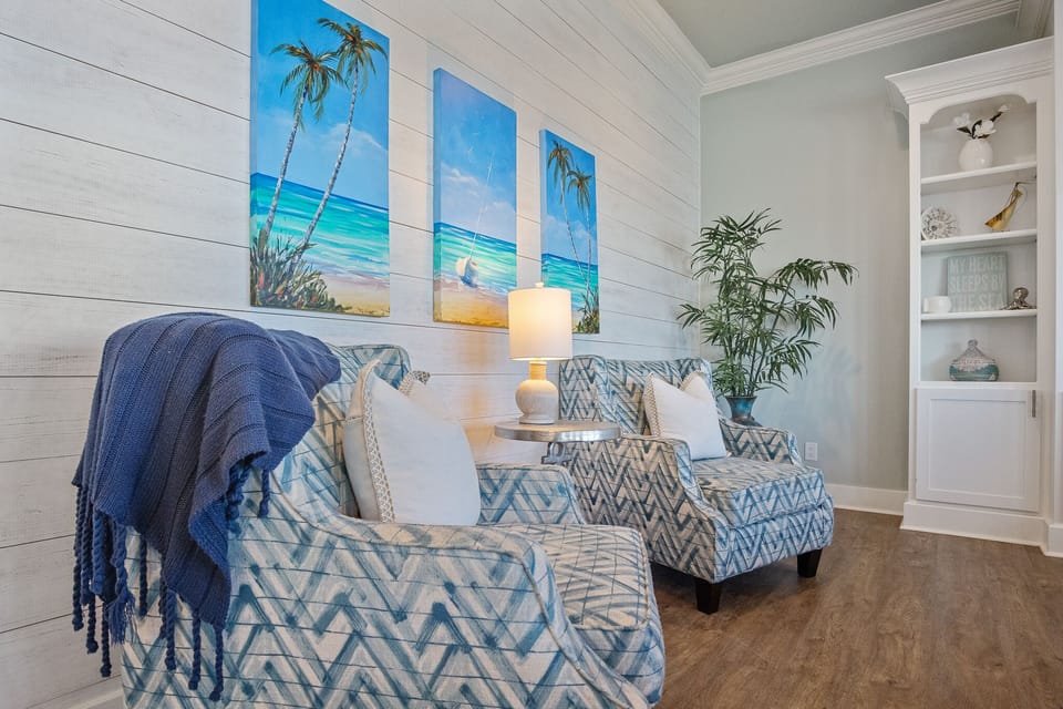 Sandy Toes Living Room: Whether you're returning from a day at the beach or embarking on a new coastal escapade, our living room beckons you to pause, unwind, and indulge in the simple pleasures of seaside living.