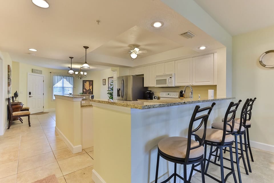 Open kitchen concept with dining room or countertop seating.