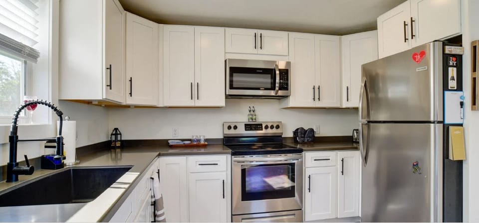Fully stocked with cooking utensils, dishes, glassware, flatware and more. 