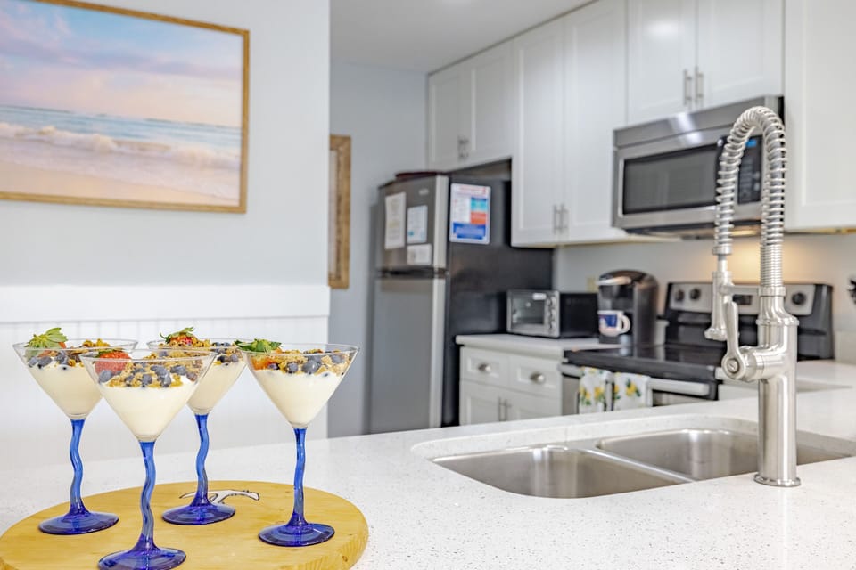 Fully stocked kitchen offers everything you will need for easy meal prep inside the condo.