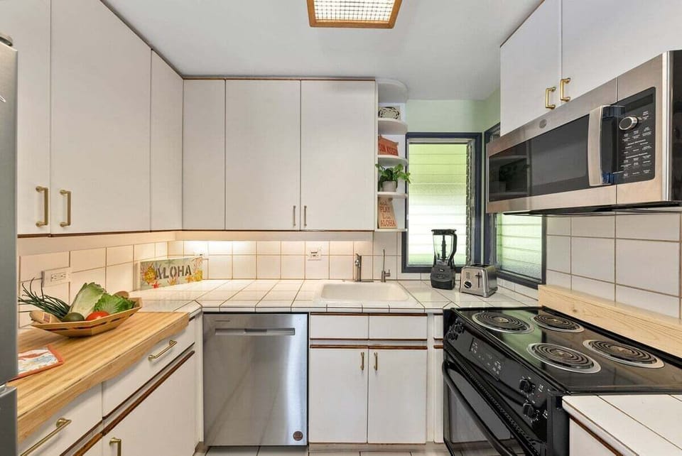 Enjoy cooking in your fully furnished kitchen with stainless steel appliances