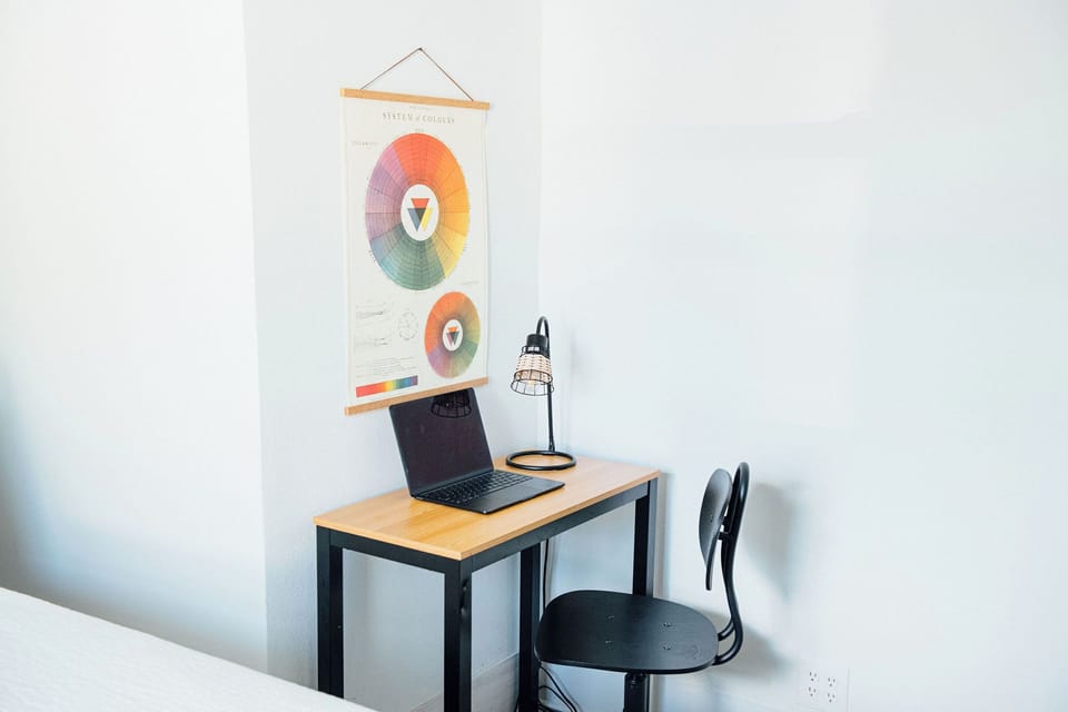 One of the bedrooms has a small desk.
