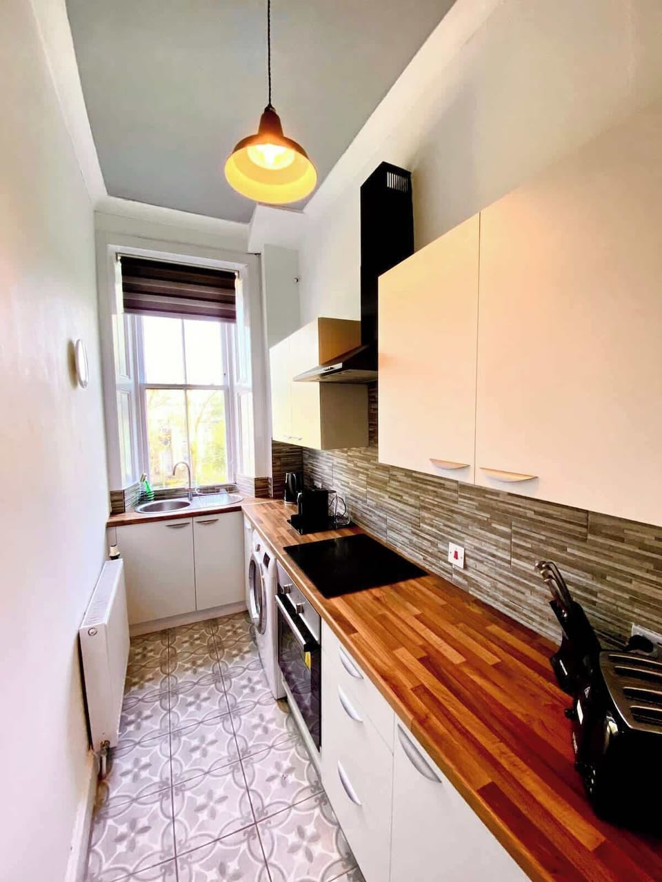 Fully equipped kitchen with essential appliances and utensils. Perfect for preparing home-cooked meals during your stay.