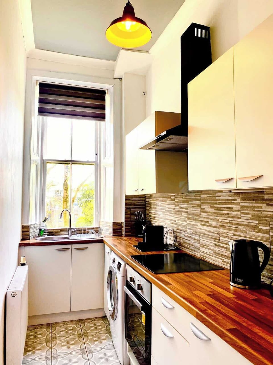 Fully equipped kitchen with essential appliances and utensils. Perfect for preparing home-cooked meals during your stay.