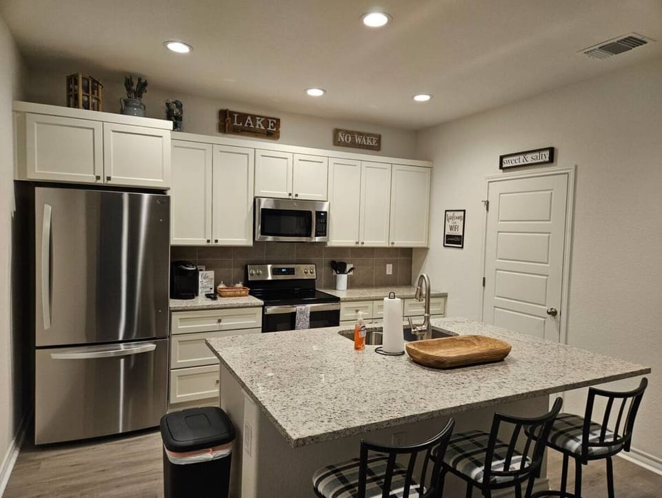 Kitchen, pantry, & looking at laundry/pantry room door.