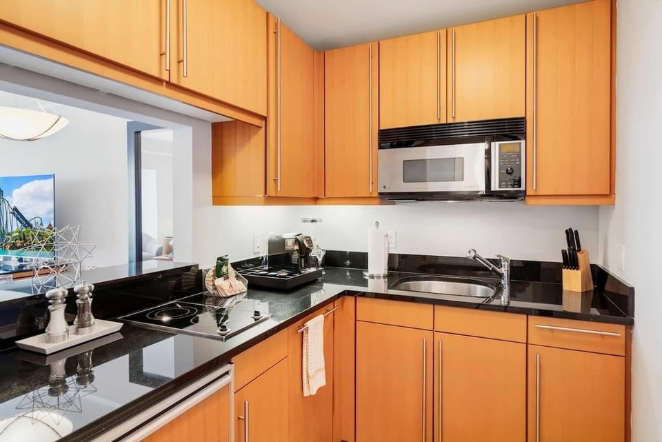 Modern Miami Kitchen Retreat: Step into this fully furnished kitchen, where modern design meets functionality. A stylish space that makes preparing meals a delight, ensuring your stay is as comfortable as it is luxurious.