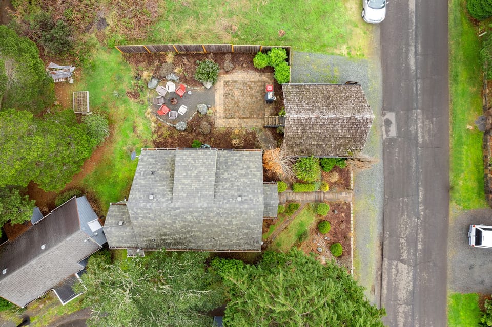 Aerial View. 4 blocks to the beach 1 block to town. Outdoor firepit, dining table.