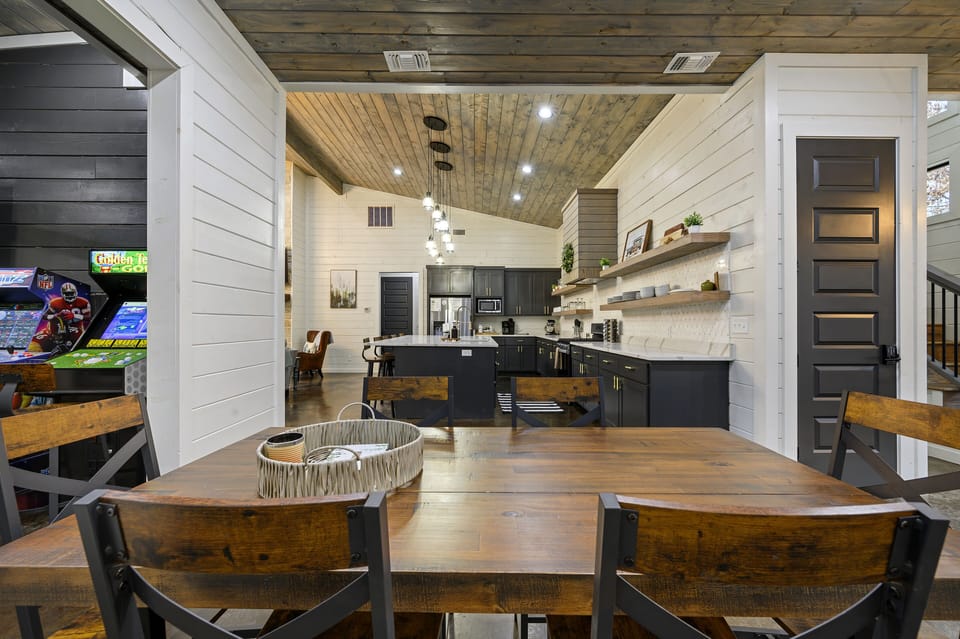Dining room with the kitchen in the background.