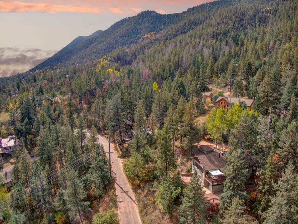 Birds eye view of this amazing house tucked on the side of Pikes Peak