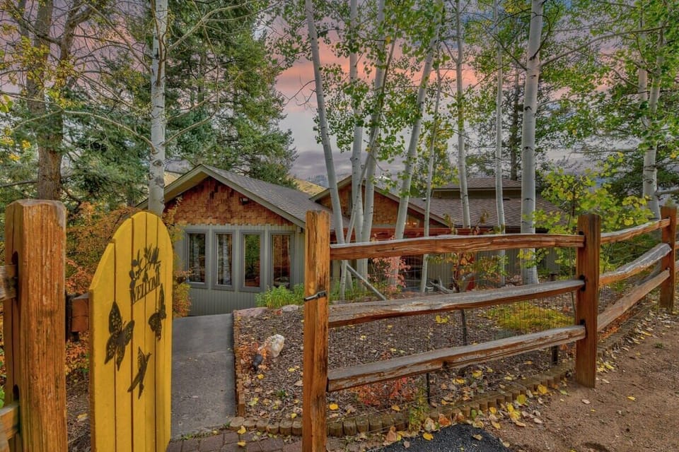 Fully fenced-in yard with whimsical landscape and decor 