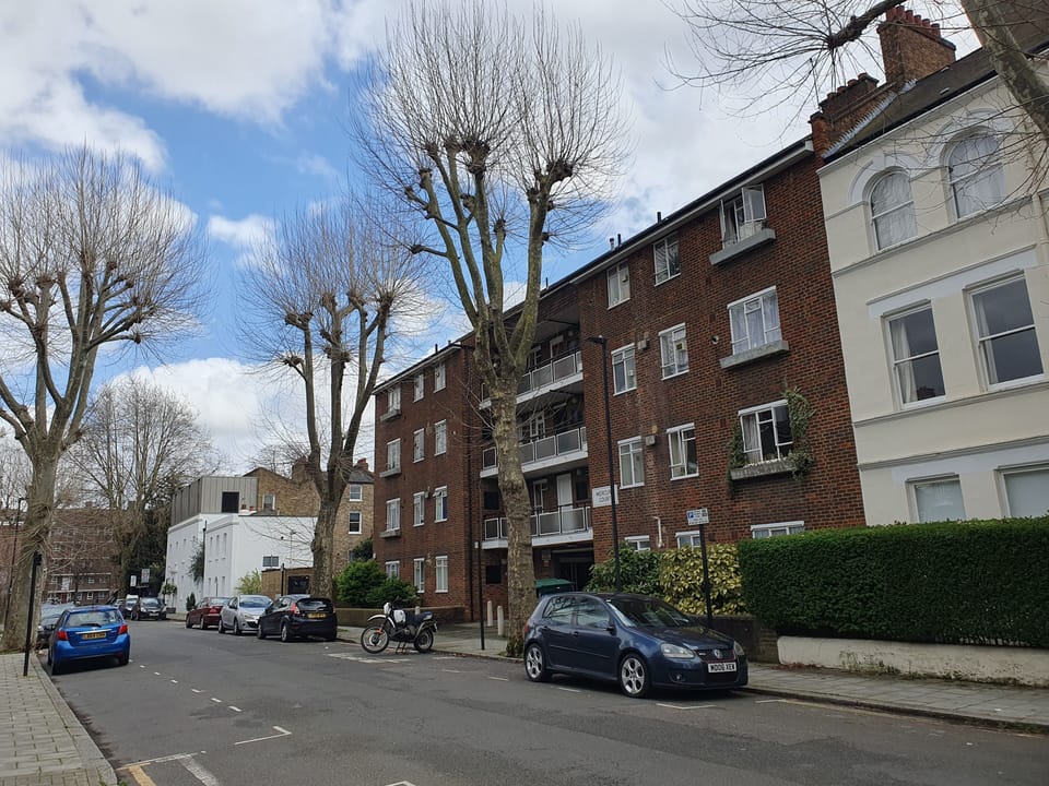 Apartment block along quiet tree lined street