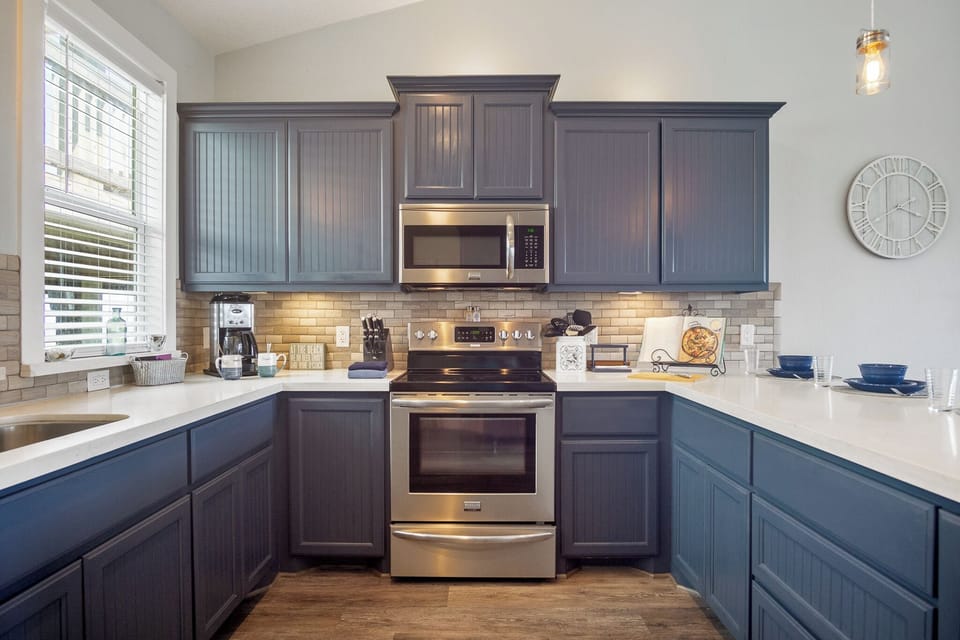 One Love Kitchen: Relax and unwind in our coastal haven, knowing that a fully stocked kitchen with ample seating and storage awaits your culinary adventures.
