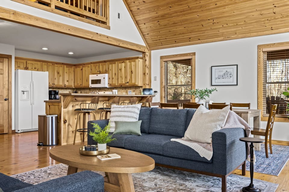 Open floor plan on the main level blends living space with kitchen and dining. 