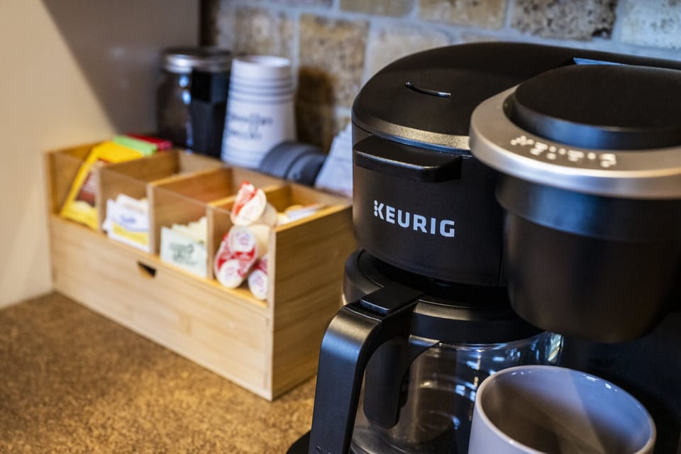 Keurig Duo coffee bar.  Drip or K-cup option with variety of sweeteners/creamer.