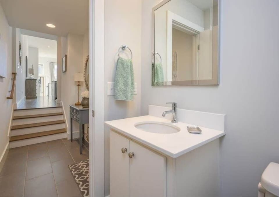 Take the steps down from the kitchen to a well-designed bathroom.