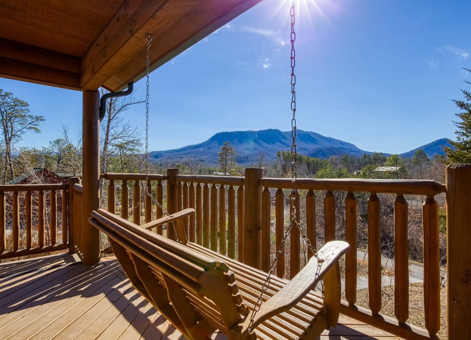 Pigeon Forge Vacation Rental "Magic Views" - Main level back deck with swing