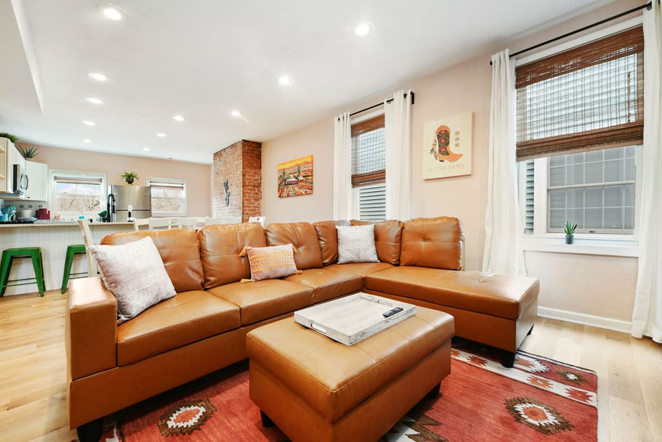 Featuring our living room sofa seating with bright and airy set up.