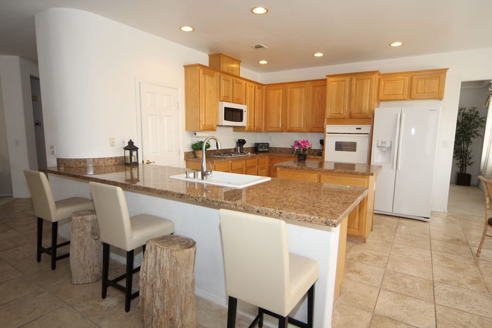 Kitchen, Bar Seating w/Petrified Wood Stools and Regular Seats